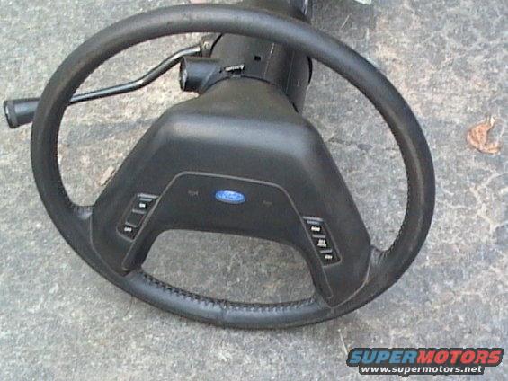 Ford steering wheel and column assembly with buttons on the spokes