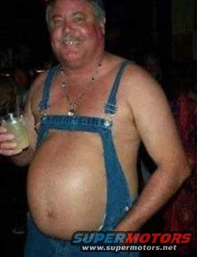 Man wearing denim overalls, holding a drink