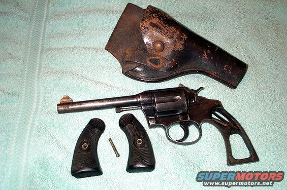 Disassembled revolver with holster and grips