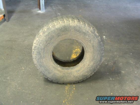 worn tire on concrete floor