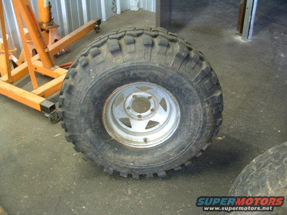 Tire and rim with aggressive tread pattern