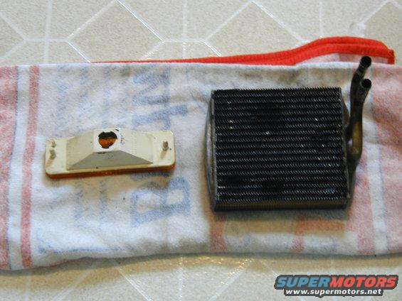 car heater core and orange turn signal light on a towel