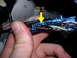 2007 Mazda 3 - Close-up of a wiring harness connector, with a yellow arrow indicating Pin W, labeled as Black/Red.