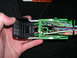2007 Mazda 3 - Close-up of a green automotive wiring harness connector with multiple colored wires.