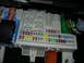 2007 Mazda 3 - Close-up view of a vehicle's interior fuse box, showing a variety of fuses and electrical connections.