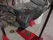 1992 Toyota Tacoma - Close-up view of a vehicle's frame and suspension components, supported by jack stands and a jack.