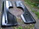 1979 Ford Bronco - Two black truck bedsides are shown laid out on the ground, likely for sale or restoration.