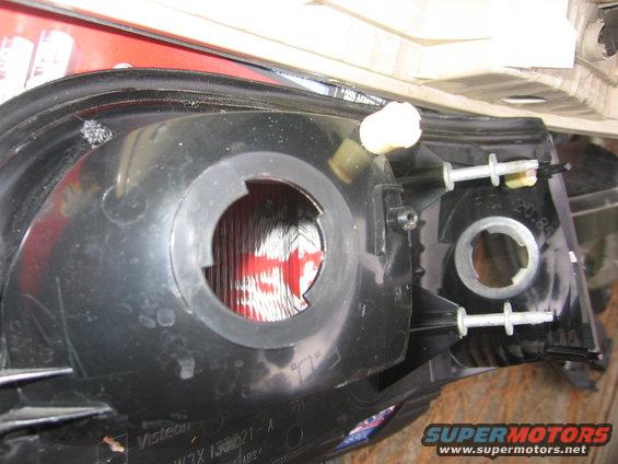 Taillight assembly with mounting bolts and bulb socket