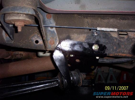 Underbody suspension part with bolts and wiring harness