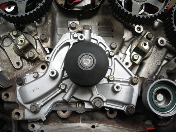 Engine water pump assembly with timing belt gears and tensioner pulley