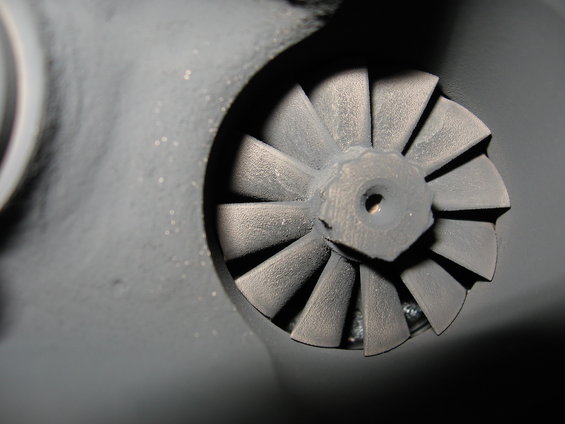 Turbocharger turbine wheel with angled blades