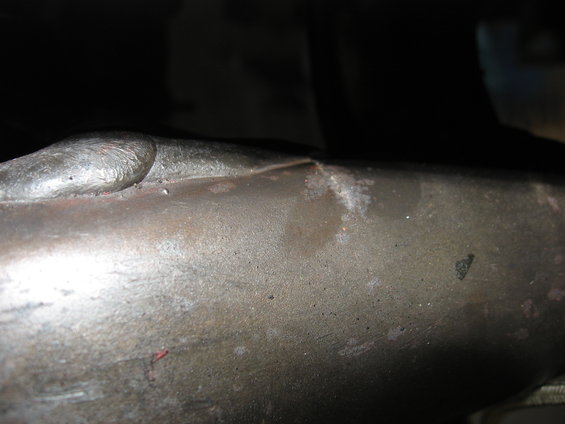 Close-up of a welded metal pipe with a visible seam