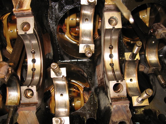 Close-up of engine crankshaft main bearings and connecting rod bearings