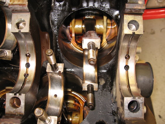 Engine block with crankshaft bearings and connecting rod caps visible