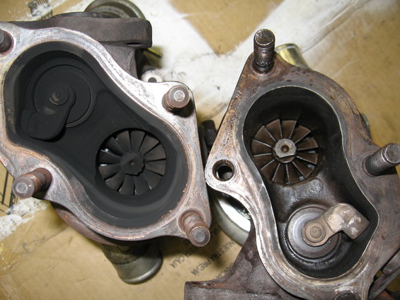 Two turbochargers, one heavily carbon-fouled, the other cleaner