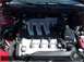 1996 Ford Probe - Close-up view of a car's engine compartment, highlighting the V6 engine components.