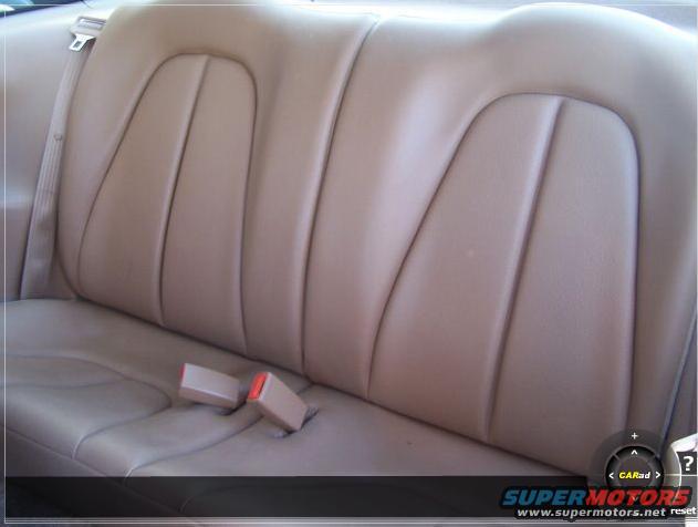 Rear car seat with two seatbelt buckles visible