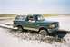 1990 Ford Bronco - This Ford Bronco is stuck in the mud, with its front right wheel submerged.