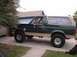 1990 Ford Bronco - Side view of a 1990 Ford Bronco with a Ford logo on the rear window.