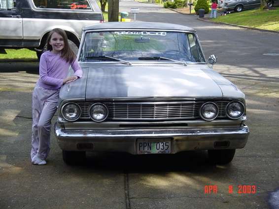 My daughters first pose with a car