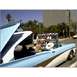 2007 Ford Ranchero - A light blue and white convertible, likely from 1956, is seen from the side with its top in the raised position.