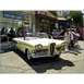 2007 Ford Ranchero - This yellow 1958 Edsel Pacer convertible is parked on a street with a building in the background.