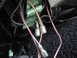 1977 Ford Mustang - This image shows a close-up view of a vehicle's electrical wiring harness with multiple connectors and wires.