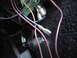 1977 Ford Mustang - Close-up view of a vehicle's electrical wiring harness, showing various colored wires and connectors.