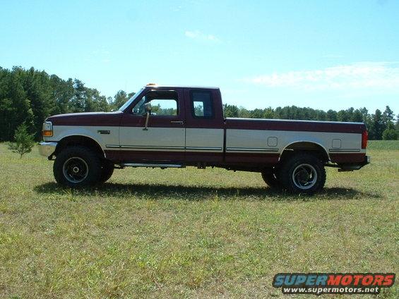 Rough Country add-a-leaves up front and new front bumper..still had to trim some so the tires wouldn't hit. Old exhaust setup in this picture. Mid-length Hedman headers, 2.25 piping with cats and 4x18 Magnaflows.