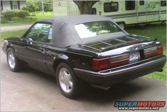 Black 1989 Ford Mustang convertible rear view with license plate CA-746