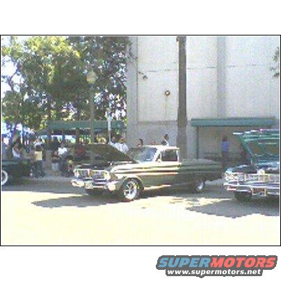 Green and white 1965 pickup truck, 3q front view