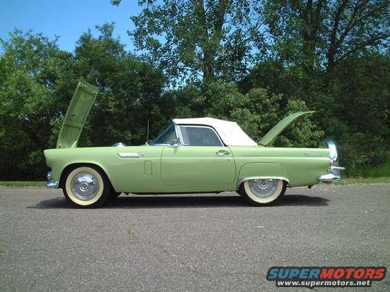 1956 Ford Thunderbird, side view, light green convertible with white top
