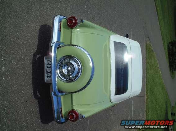 1956 Ford Thunderbird convertible, rear view, light green with white top