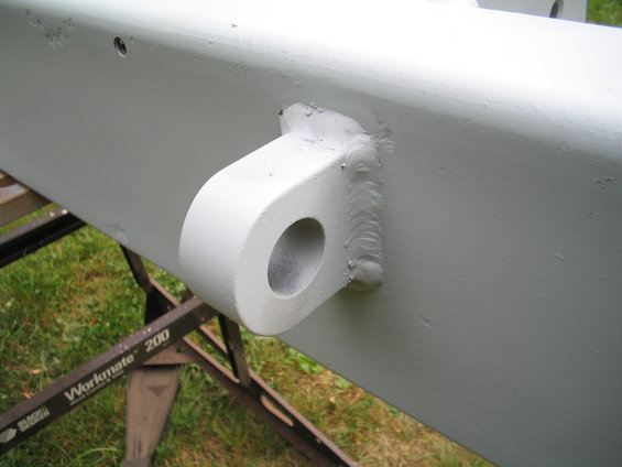 Painted metal beam with welded tow hook attachment