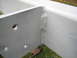 1979 Ford Bronco - This image shows a section of a white painted metal structure with prominent welds and bolt holes.