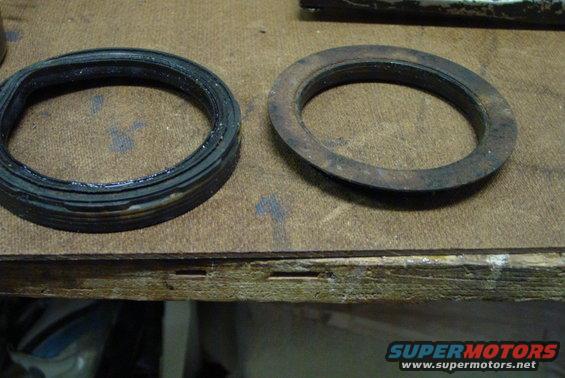 Two gaskets, one new and one rusted, on a workbench