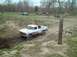 1979 Ford F-150 - A white 1979 Ford F-150 navigates a muddy track in an off-road park.