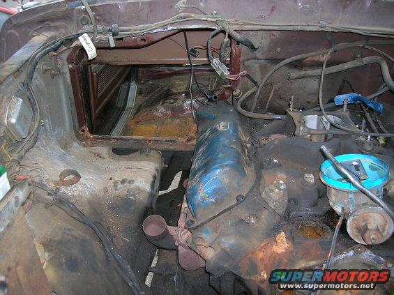1978 Ford F-250 engine bay with blue valve covers and rusted components