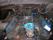 1978 Ford F-250 - Engine bay of a 1978 Ford F-250, showing the carburetor and distributor during a teardown.