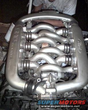 This is my engine when i had the intake off so that i could replace the valve gaskets. I was just about ready to lower it back in. (that's me in the dirty shirt behind it)
