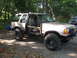 1979 Ford Bronco - This lifted SUV has been modified with off-road tires and has had its doors removed for a appearance.