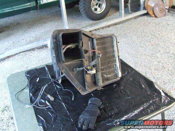 Heater core assembly with wiring and glove on a table