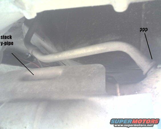 underneath shot of a stock y-pipe and part of the exhaust system