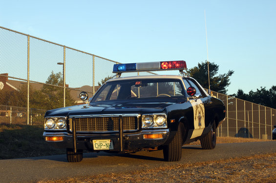 Police car with light bar, CHP-NH plate. Looks like a 1977 model