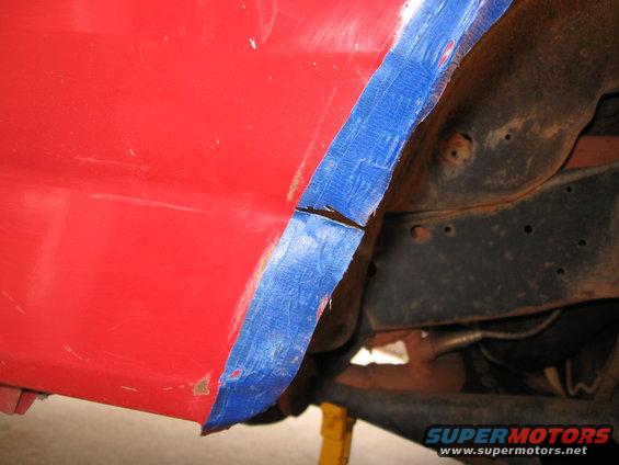 img_0865.jpg Cut along the seam of the fender and start bending.  