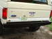 1989 Ford Bronco - Rear view of a white Ford Bronco showing its bumper and license plate.