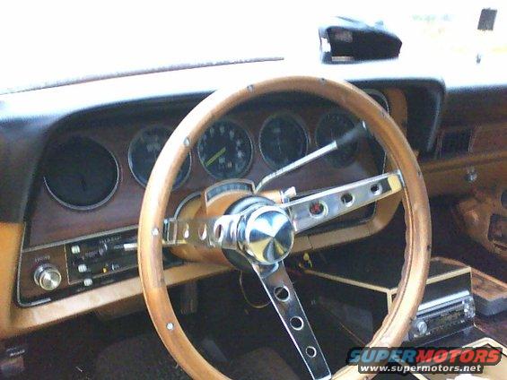 1979 Ford Ranchero interior with wood-grain dash and aftermarket steering wheel