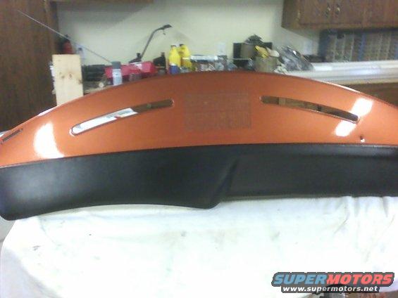 Orange and black dashboard section with two horizontal vents