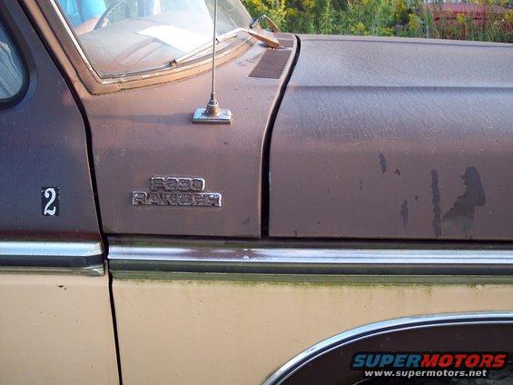 Close-up of a brown Ford F-250 Ranger truck fender and hood