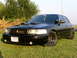 2001 Ford Crown Victoria - Customized 2001 Ford Crown Victoria with aftermarket wheels and hood scoops.
